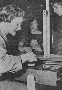 Cashier Mrs Hilda Goodwin at work in the ticket office.