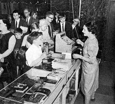 Mrs Pat Godden is kept busy at the counter of the smaller of the two souvenir shops in the Tower foyer